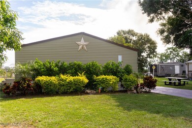 View of home's exterior with a patio and a yard