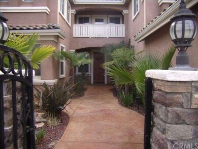 Stamped concrete courtyard that leads to the front