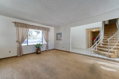 Living Room View of Foyer and stairs to 2nd floor