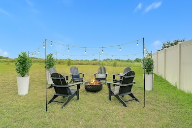 Headshot: Virtually Staged backyard - chairs plants and lights for illustration purposes only