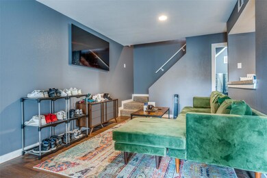 Living room with dark wood-type flooring
