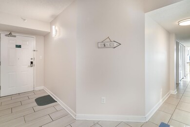 Foyer entrance with a textured ceiling