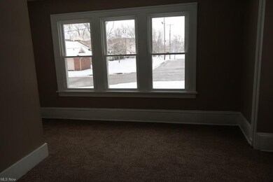 bedroom 2 on main floor w/ new front windows