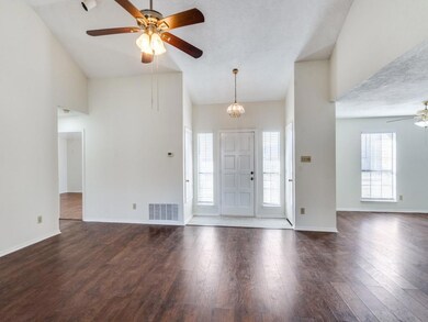 Entrance foyer with dark wood-type flooring, lofte