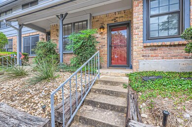 View of exterior entry with brick siding