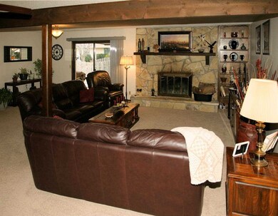 Beamed Ceiling and Stone Fireplace