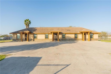 Ranch-style home with stone siding and stucco siding