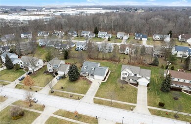 Overhead aerial view shows fenced yard