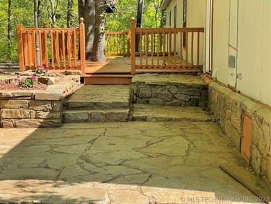 Large back deck with native rock walkway and botto
