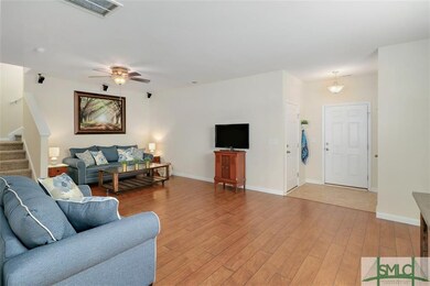 Front Door and Access to Garage on Left with 1/2 B