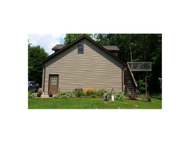 Exterior Front. Side view showing the back deck.  