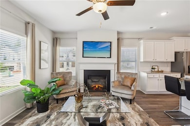 Living room featuring a wealth of natural light, c