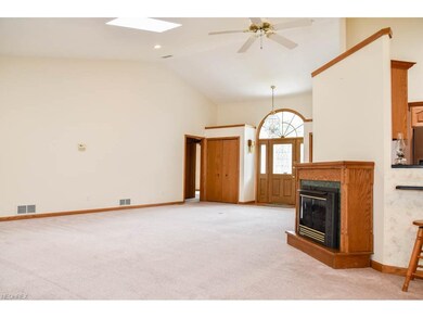 Great room with vaulted ceilings, a gas fireplace 