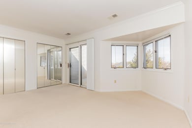 Bedroom Suite Two with balcony access.