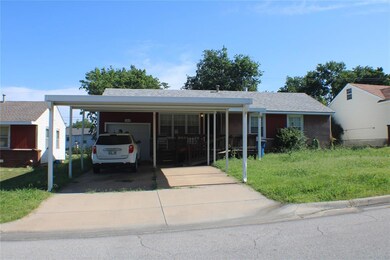 View of front of property featuring a carport and 