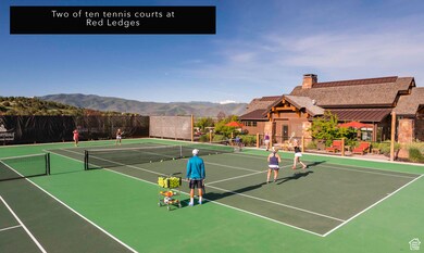 View of tennis court with a mountain view