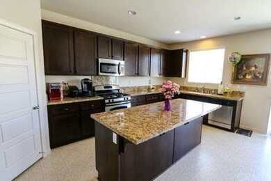 Mocha Cabinetry and Stainless Steel Appliances