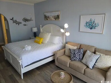 Bedroom featuring dark wood-type flooring