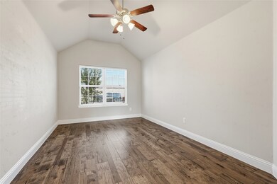 Private office featuring custom wall texture, wood floors, high ceiling, ample natural light and french doors for privacy.