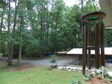 Great view of the driveway and carport from the po
