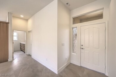 Entryway featuring baseboards and recessed lightin