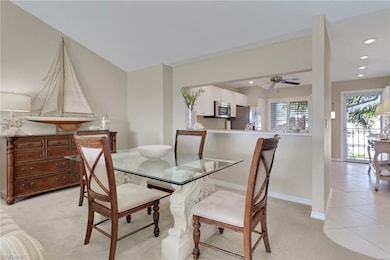Dining space featuring light colored carpet, recessed lighting, light tile patterned floors, and a ceiling fan
