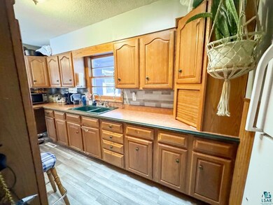 Kitchen featuring stainless steel microwave, frees