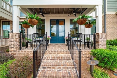 Entrance to property with ceiling fan