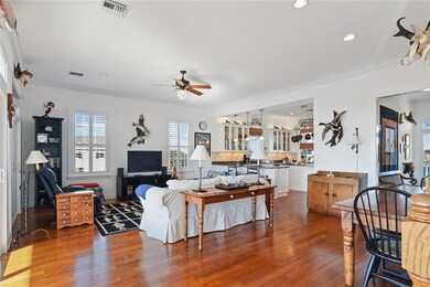 Spacious open den with wood floors