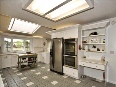 Huge kitchen...tile floors, corian counters, high 