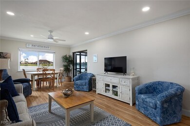 Living area featuring light wood-style flooring, crown molding, ceiling fan, and recessed lighting
