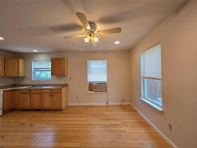Kitchen featuring light wood finished floors, rec