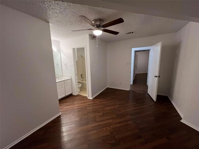 Unfurnished bedroom featuring ensuite bath, ceilin