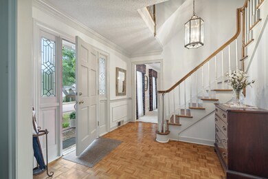 Entrance foyer featuring light parquet flooring, o