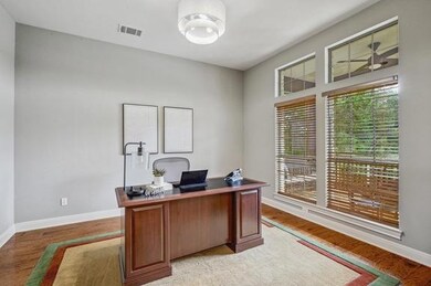 Office space with baseboards, light wood-style fl