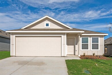 View of front facade with a garage and a front yar