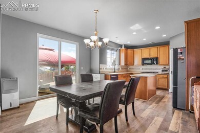 Dining space featuring a chandelier, light wood finished floors, and recessed lighting
