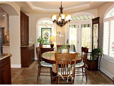 Sunny breakfast room with ceramic tile flooring, p