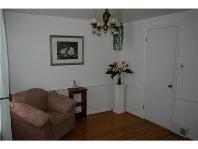 Dining Room. Formal dining with a door to kitchen and an open entrace to foyer.