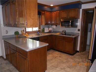 Kitchen with Corian countertops and subway tile ba