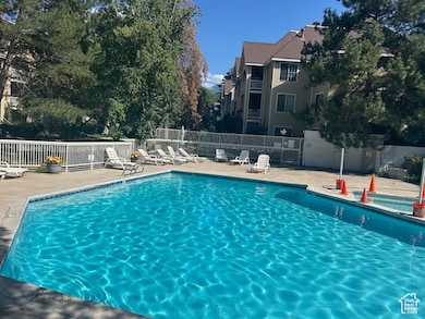 Community pool with a patio