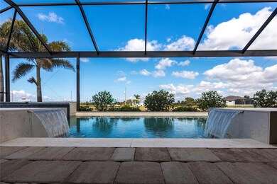 Oversized 424  Sq Ft  heated salt water pool with decorative waterfall and Picture Window screened pool cage