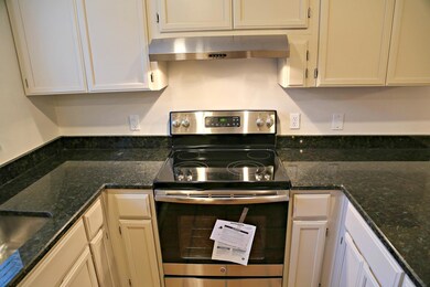 Kitchen with under cabinet range hood, stainless 