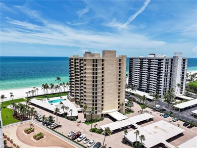 Drone / aerial view of expansive beach and apartment complex