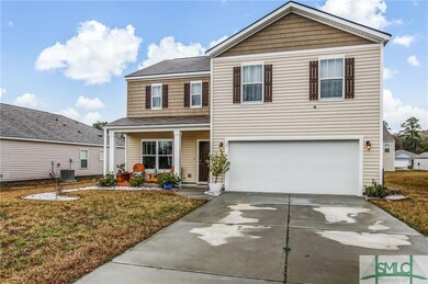 FRONT OF HOME WITH GARAGE AND FRONT PORCH VIEWS
