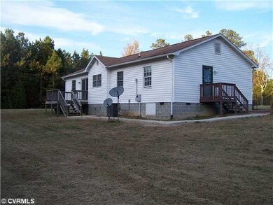 Exterior Back - separate side entrance into den or