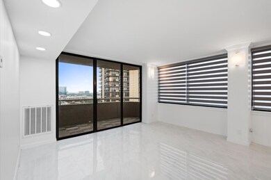 This modern living room features large windows wit