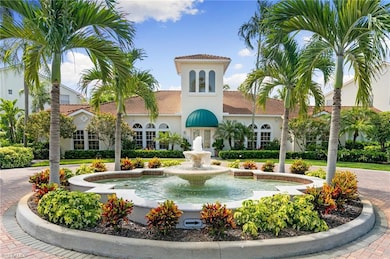 View of building exterior featuring curved driveway