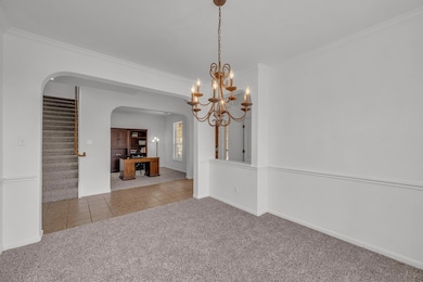 Unfurnished dining area with arched walkways, lig