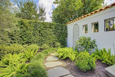 Beautiful landscape maintained by the distinguished Thompson + Hanson, exhibits an abundance of greenery with multiple gardens, conveying a serene ambiance. The architecturally significant wall with antique door leads to your backyard oasis. 
